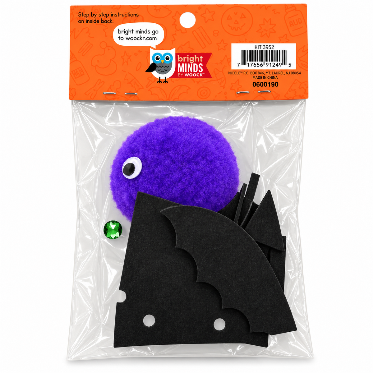 Bright Minds by Woodz Halloween craft kit containing a purple pom-pom with a googly eye, black bat-shaped foam pieces, a green rhinestone, and an orange instruction card inside a clear plastic bag.